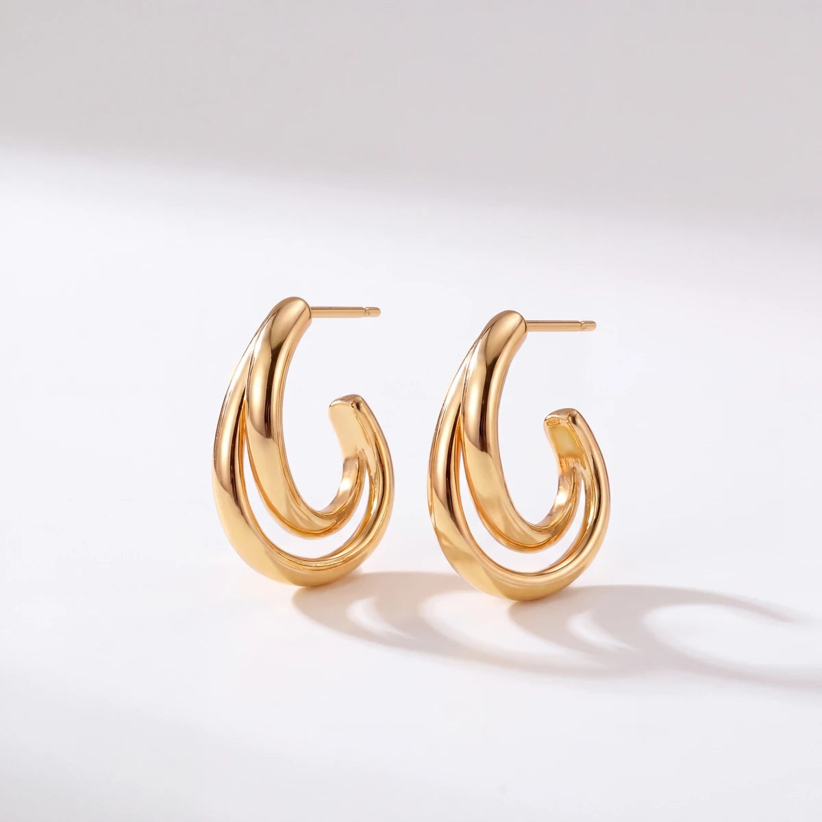 Liora twisted hoop earrings for women, gold-tone - RANGREZ
