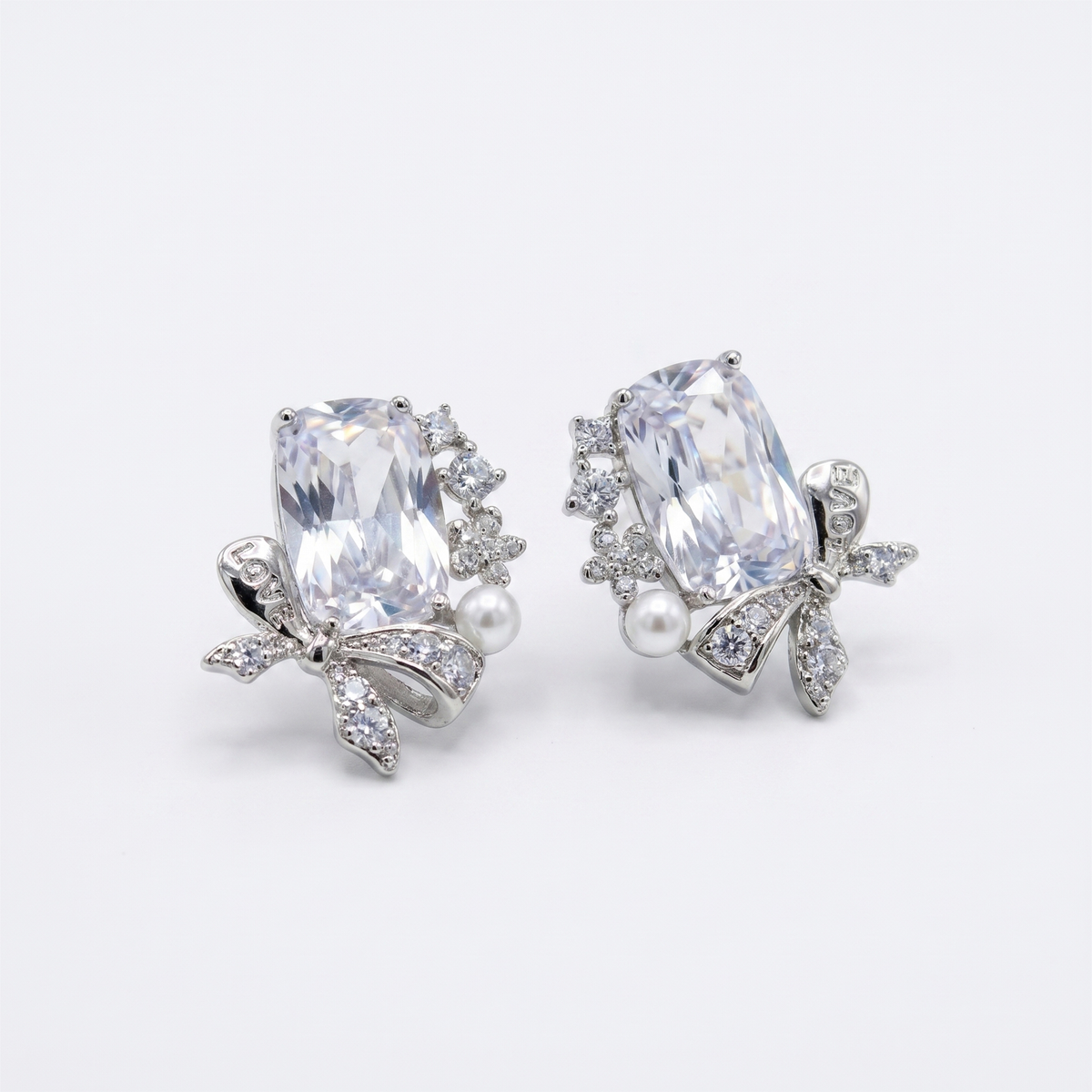 Bowelle White Crystal & Pearl Bow Stud Earrings, Cushion cut, Rhodium finish
