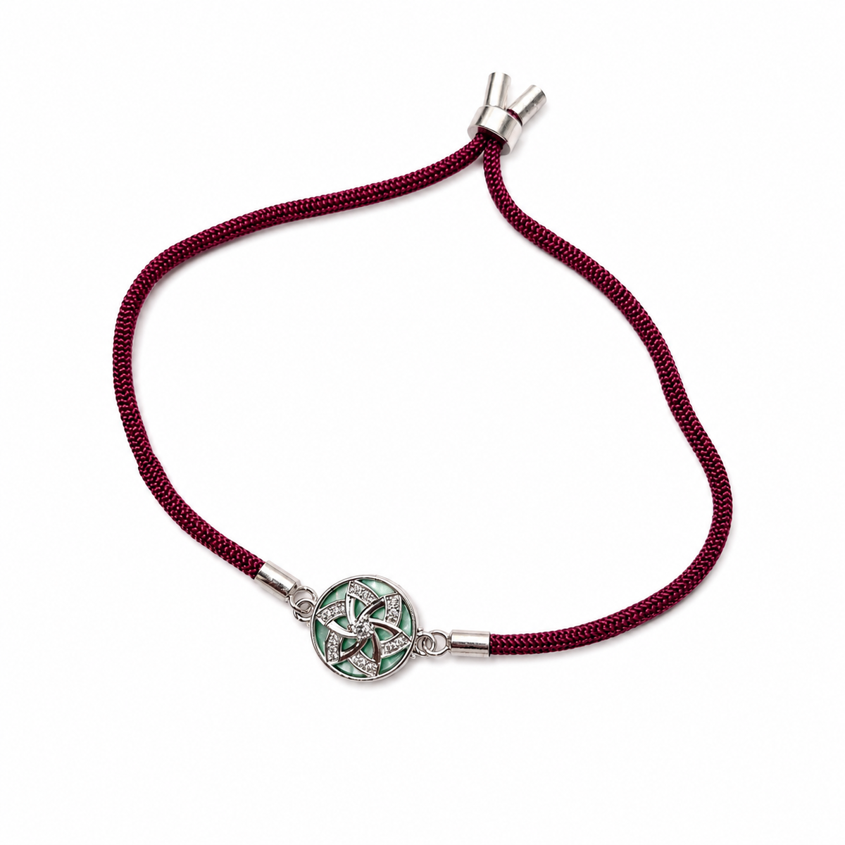 Green Pinwheel CZ Disc 92.5 Silver Rakhi on Maroon Cord