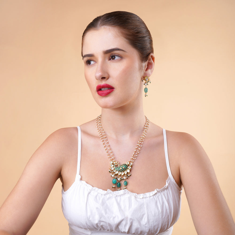 Traditional Indian bridal jewelry set with green stone drops & pearls