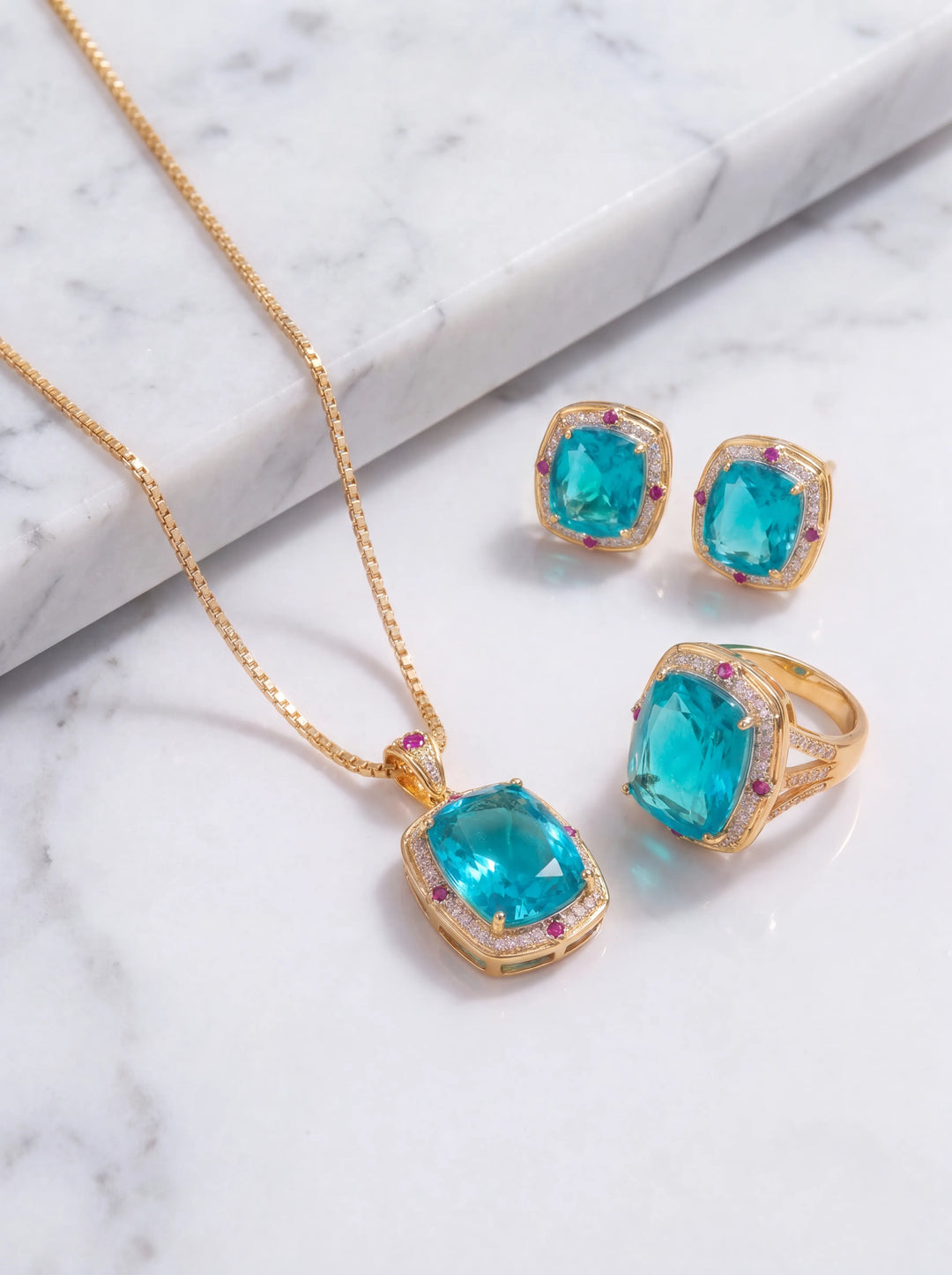 Oceana turquoise blue crystal necklace, earrings and ring combo set in gold