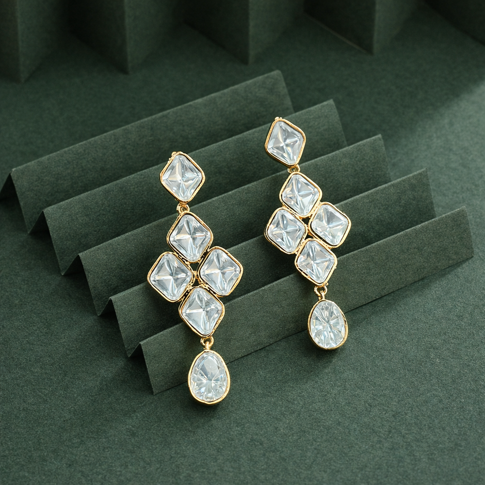 Close up of clear stone detailing on Rangrez gold finish drop earrings