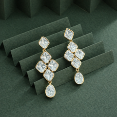 Close up of clear stone detailing on Rangrez gold finish drop earrings